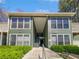 Two-story condo building with well-maintained landscaping and a pedestrian walkway at 4640 Vinings Central Se Run # 128, Atlanta, GA 30339