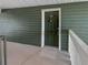 A green front door with silver hardware is visible from the condo's walkway at 4640 Vinings Central Se Run # 128, Atlanta, GA 30339