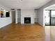 Spacious living room features hardwood floors, a fireplace, and balcony access at 4640 Vinings Central Se Run # 128, Atlanta, GA 30339