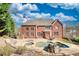 Gorgeous brick home showcasing an outdoor pool, patio seating, and a landscaped yard perfect for entertaining at 4777 Ardmore Ln, Hoschton, GA 30548