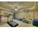 Spacious basement with gym equipment, including a treadmill and weights for a convenient home workout space at 4777 Ardmore Ln, Hoschton, GA 30548