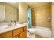 Bathroom featuring a bathtub, a toilet, a sink, and decoratively painted walls at 4777 Ardmore Ln, Hoschton, GA 30548