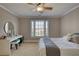 Bright bedroom with a desk area, and a large window that provides natural light at 4777 Ardmore Ln, Hoschton, GA 30548