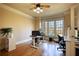 Bright home office featuring hardwood floors, a large window, and a modern desk setup at 4777 Ardmore Ln, Hoschton, GA 30548