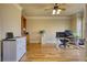 Bright home office with hardwood floors, custom built-ins, and modern desk setup at 4777 Ardmore Ln, Hoschton, GA 30548