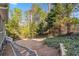 View of a well-maintained backyard featuring a path leading to a seating area at 1142 Hidden Spirit Trl, Lawrenceville, GA 30045
