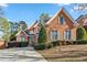 Charming brick home with manicured landscaping and a welcoming driveway at 1142 Hidden Spirit Trl, Lawrenceville, GA 30045