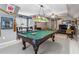 Spacious game room features a pool table, comfortable seating, and sports memorabilia at 1142 Hidden Spirit Trl, Lawrenceville, GA 30045