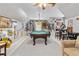 Finished game room features a billiards table, bar, and wall decor at 1142 Hidden Spirit Trl, Lawrenceville, GA 30045