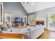 Spacious living room with vaulted ceiling, fireplace, and natural light at 1142 Hidden Spirit Trl, Lawrenceville, GA 30045