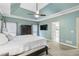 Main bedroom boasts a tray ceiling, ensuite bathroom, and closet with doors at 1142 Hidden Spirit Trl, Lawrenceville, GA 30045