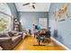 Home office featuring hardwood floors, large windows for natural light, and a ceiling fan at 1142 Hidden Spirit Trl, Lawrenceville, GA 30045