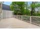 A bright back deck features geometric railings and pergola at 53 Paces West Nw Dr, Atlanta, GA 30327