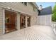 The white back deck spans the back of the home and connects to the interior via French doors at 53 Paces West Nw Dr, Atlanta, GA 30327