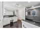 Bright bathroom with dual vanity, granite countertops, marble floors, and glass-enclosed shower at 53 Paces West Nw Dr, Atlanta, GA 30327
