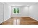 A bedroom features hard wood floors, fresh paint, and large window at 53 Paces West Nw Dr, Atlanta, GA 30327