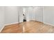 Spacious bedroom with hardwood floors, double closets, and an attached bathroom at 53 Paces West Nw Dr, Atlanta, GA 30327