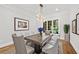 Elegant dining room with a modern chandelier, hardwood floors, and a large window at 53 Paces West Nw Dr, Atlanta, GA 30327