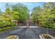 Elegant gated entrance provides privacy and security, with beautiful landscaping enhancing its curb appeal at 53 Paces West Nw Dr, Atlanta, GA 30327