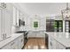 Modern kitchen with white cabinetry, stainless steel appliances, and a large island at 53 Paces West Nw Dr, Atlanta, GA 30327