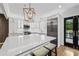 An island anchors this bright kitchen with stainless appliances and french doors at 53 Paces West Nw Dr, Atlanta, GA 30327