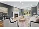 Bright living room features a fireplace, large window, and neutral decor at 53 Paces West Nw Dr, Atlanta, GA 30327