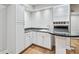 Wet bar featuring sleek countertops, ample cabinet space, and modern fixtures for easy entertaining and refreshments at 53 Paces West Nw Dr, Atlanta, GA 30327