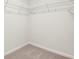 Walk-in closet with ample shelving that provides functional storage space at 6345 Towhee Way, Morrow, GA 30260