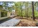 View of a backyard featuring a gravel path leading to a raised deck at 541 Earlvine Nw Way, Kennesaw, GA 30152