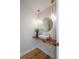 Stylish half bathroom with modern sink, custom wood countertop, and elegant lighting fixtures at 541 Earlvine Nw Way, Kennesaw, GA 30152
