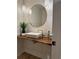 Modern powder room with white textured wall, wood counter, bowl sink, and gold faucet at 541 Earlvine Nw Way, Kennesaw, GA 30152