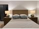 Modern bedroom boasts stylish nightstands with lamps flanking a cozy bed at 541 Earlvine Nw Way, Kennesaw, GA 30152