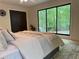 Charming bedroom features a large window, modern decor, and cozy carpet at 541 Earlvine Nw Way, Kennesaw, GA 30152