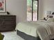 Relaxing bedroom offers a dresser and view to the outdoors at 541 Earlvine Nw Way, Kennesaw, GA 30152