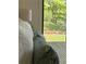 Comfortable bedroom features soft pillows and a view of the green outdoors at 541 Earlvine Nw Way, Kennesaw, GA 30152