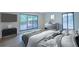 Bright bedroom with a big window to the trees and backyard, features modern furniture and neutral tones at 541 Earlvine Nw Way, Kennesaw, GA 30152