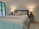 The spacious bedroom is furnished with comfortable bedding and side tables with lamps at 541 Earlvine Nw Way, Kennesaw, GA 30152