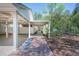 Long brick walkway leads to an entrance and is flanked by a spacious carport and lush greenery at 541 Earlvine Nw Way, Kennesaw, GA 30152