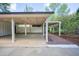 Spacious carport features ample parking with a brick walkway leading to the entrance at 541 Earlvine Nw Way, Kennesaw, GA 30152