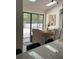 Open dining room features modern lighting and a view of the outdoor patio at 541 Earlvine Nw Way, Kennesaw, GA 30152