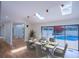 Bright dining room boasts skylights and sliding glass doors to the outdoor pool area at 541 Earlvine Nw Way, Kennesaw, GA 30152