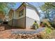 Exterior of the home featuring light siding and a dark roofline at 541 Earlvine Nw Way, Kennesaw, GA 30152