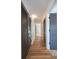 Hallway features hardwood floors, painted doors, and closet space with modern styling at 541 Earlvine Nw Way, Kennesaw, GA 30152