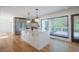 Modern kitchen with a large island, stainless steel appliances, and an open view to the outdoor deck at 541 Earlvine Nw Way, Kennesaw, GA 30152