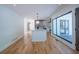 Open-concept kitchen featuring a large island with a white countertop, stainless steel appliances, and modern lighting at 541 Earlvine Nw Way, Kennesaw, GA 30152