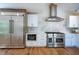 Modern kitchen with stainless steel appliances, custom cabinetry, and hardwood flooring throughout at 541 Earlvine Nw Way, Kennesaw, GA 30152