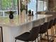 Stylish kitchen island with marble countertop, modern stools, and open layout, great for entertaining at 541 Earlvine Nw Way, Kennesaw, GA 30152