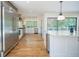 Bright, open kitchen with stainless steel appliances, hardwood floors, and a center island with granite countertops at 541 Earlvine Nw Way, Kennesaw, GA 30152