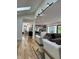 Spacious living room features modern track lighting and seamless flow to the kitchen at 541 Earlvine Nw Way, Kennesaw, GA 30152
