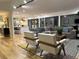 Open living room with stylish seating, contemporary lighting, and seamless flow to the kitchen at 541 Earlvine Nw Way, Kennesaw, GA 30152